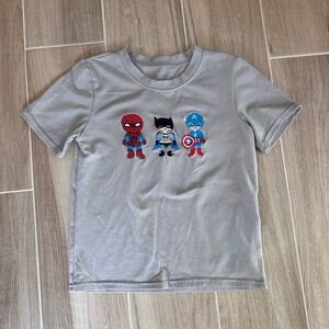 Custom super hero embroidered short sleeve gray shirt. 6/7